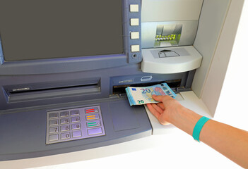 European banknotes from an ATM cash machine and the numeric keypad to enter the PIN