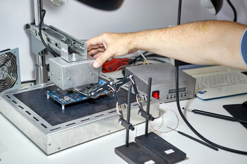 When repairing the motherboard, the chip is unsoldered. Repair and maintenance of computers.