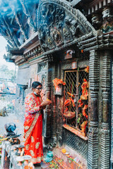 Hindu Woman offering prayers to God