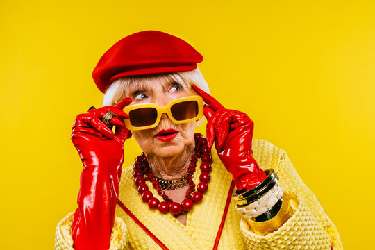 Cool And Stylish Senior Old Woman With Fashionable Clothes - Colorful Portrait Of Funny Happy Elderly Lady On Colored Background