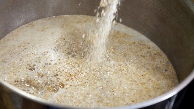 Malt is poured into the brew kettle for mashing