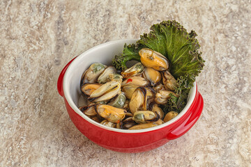 Tasty marinated mussels in the bowl