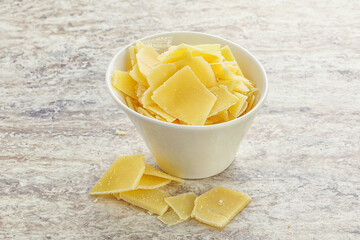 Sliced parmesan cheese heap in the bowl