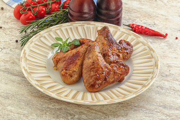 Roasted chicken wings with spicy sauce