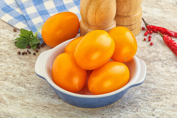 Sweet ripe yellow tomato in the bowl