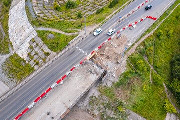 Work to modernization and repair of highway damage of bridge, aerial top view