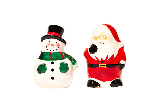 isolated figurines of santa claus and snowman