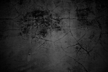 Cracked walls dark gray concrete, concrete floor is aged in a retro concept, Texture of a grungy black concrete wall as background.