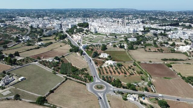 Aerial shot with drone of Locorotondo the white city in the Itria valley, Puglia, southern Italy.