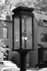 old street lamp in the city in black and white monochrome 