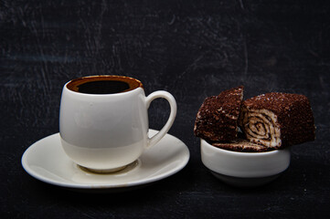 Turkish coffee and Turkish delight on black background.