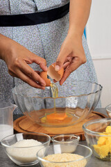 Female Hand Broken Egg to the Bowl, Baking Process in the Kitchen