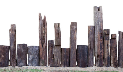 Isolation of a decayed wooden stump, which is installed as an artifical fence on the sand in the...