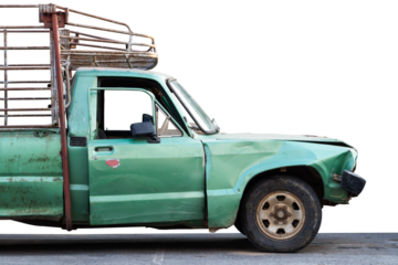 Isolate front side of the old green pickup truck, which crashed accidentally.