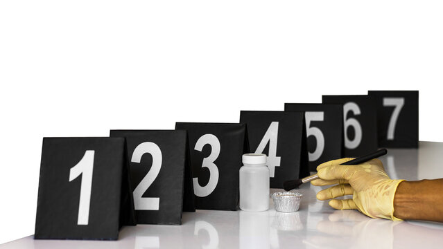 Tag number for forensic examination at the scene, along with accessories and hand gloves.