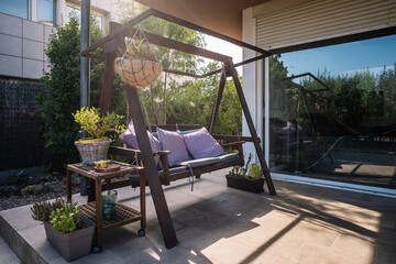 Veranda with swing in sunny weather