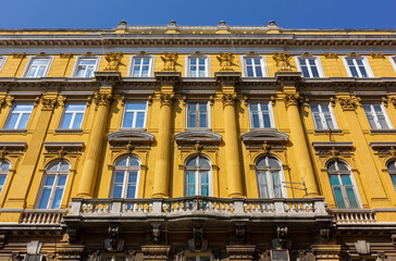 Fototapeta na wymiar Richly decorated facade of historic Ploech palace in Rijeka, Croatia, designed by architect Giacomo Zammattio