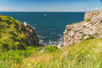 steep cliffs of nothern Bornholm coastline at baltic sea, Denmark