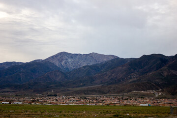 Naklejka premium Landscape with mountains and clouds