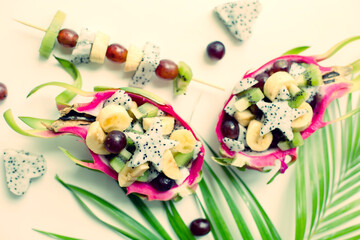 fresh exotick fruit dessert with varios colorful peace of fruits over white background