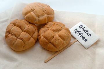 Gluten-free buns on a light background. Label with the inscription gluten-free