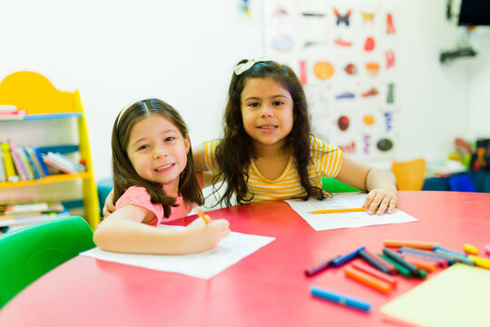 Mixed-race Preschool Friends Doing School Work Together