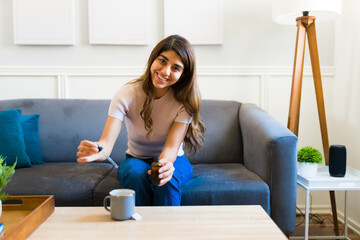 Gorgeous young woman using supplement vitamins on her drink
