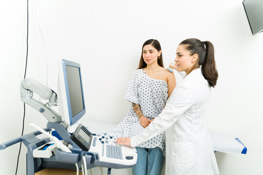 Hispanic woman doing an ultrasound exam at the imaging diagnostic center