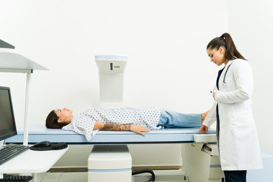 Sick woman getting a densitometry scan test at the imaging diagnostic center