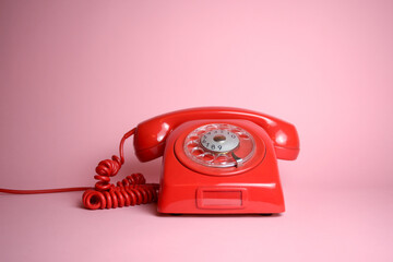 Classic rotary dial telephone in red isolated - obrazy, fototapety, plakaty