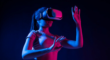 Brunette woman Architect worker wearing VR headset for working design of new architectural project in dark studio. Technology futuristic virtual reality design.