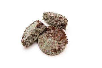 The three mouldy grounded coffee capsules from the coffee machine because of bad cleaning or...