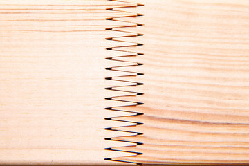 The detail of the toothed connection of two planks. Precise carpenter work. 