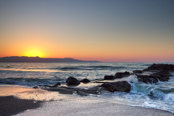 Beautiful sea and waves crashing against a jetty
