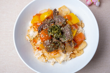 Delicious Korean style dish Steak over rice