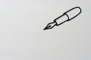 paper silhouette of a writing instrument