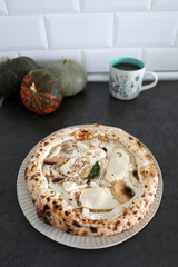 Frozen pizza with smoked cheese and mushrooms