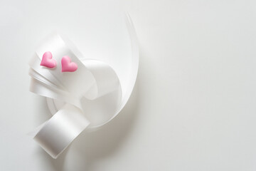 white ribbon and fabric hearts