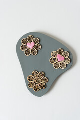 wooden floral ornaments with pink hearts