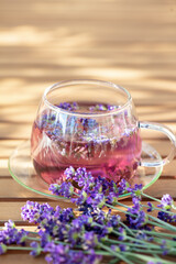 Obraz na płótnie Canvas Glass cup of lavender tea.