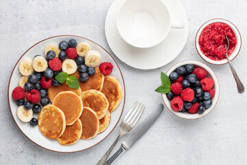 Keto diet pancakes made or almond flour, served with berries.