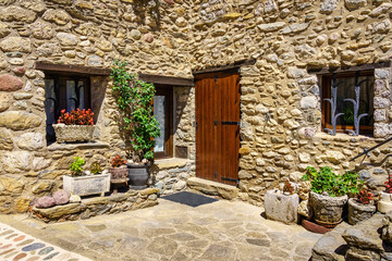 Facade of a typical house made of stone in the mountains of Catalonia, Beget, Girona.