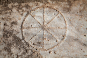 An ancient Roman game-stone carved in the floor. Didyma, Aydin, Turkey