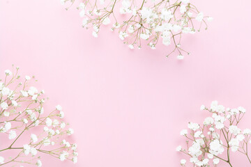 Naklejka na ściany i meble Beautiful flower background of pink gypsophila flowers. Flat lay, top view. Floral pattern.