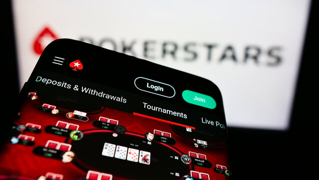 Stuttgart, Germany - 01-06-2022: Mobile phone with webpage of online poker cardroom PokerStars on screen in front of business logo. Focus on top-left of phone display.