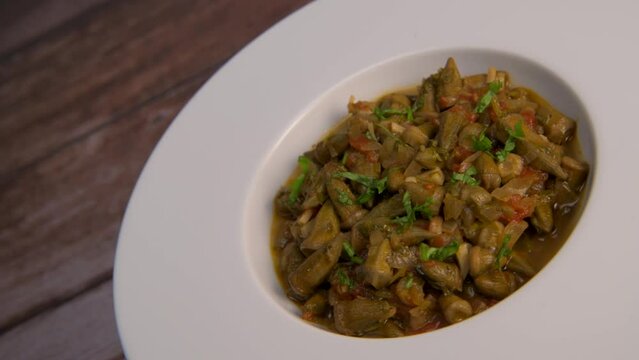 Bhindi masala or ladies finger fry served with indian roti chapati or Indian Flat bread. High quality video