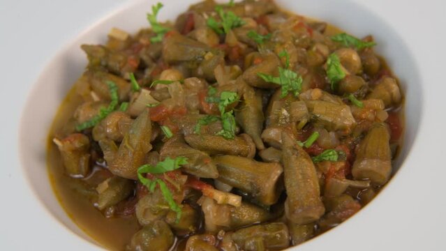 Bhindi masala or ladies finger fry served with indian roti chapati or Indian Flat bread. High quality video