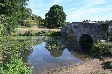 Fototapeta na wymiar A Medieval stone bridge at a Country Estate in Surrey. 