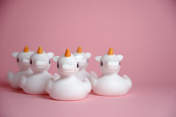 A flock of unicorns isolated on pink