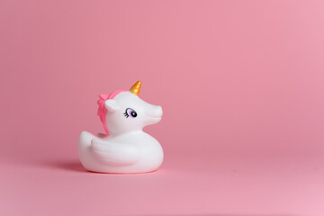 Close-up unicorn on pink copy space © Jesse